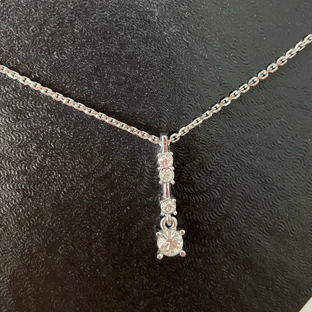 Gorgeous Swarovski Crystal four tiered pendant necklace. 16” chain.